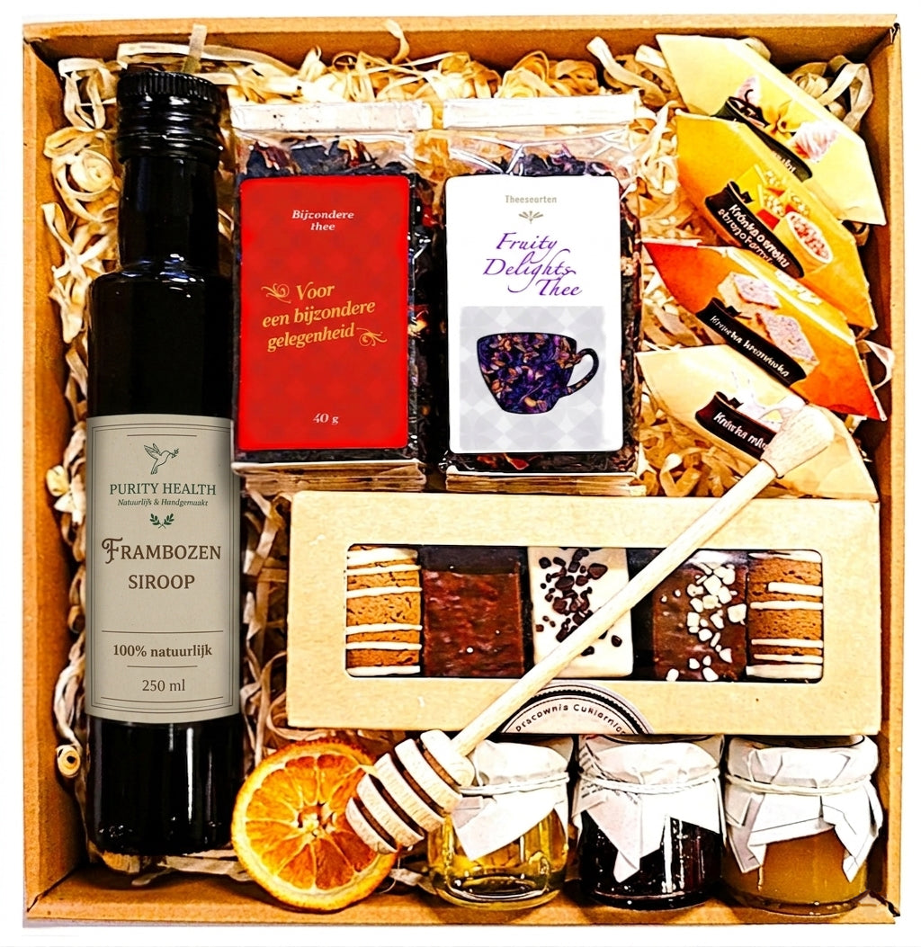 Cadeaupakket met thee, siroop, jam, honing, kruidkoekjes en caramels